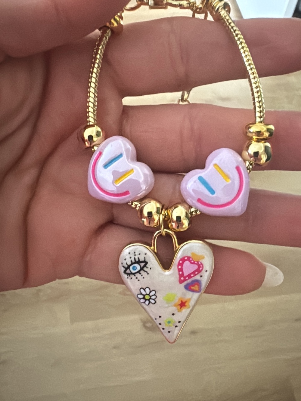 Gold-Tone Bracelet with Pink Heart Charms